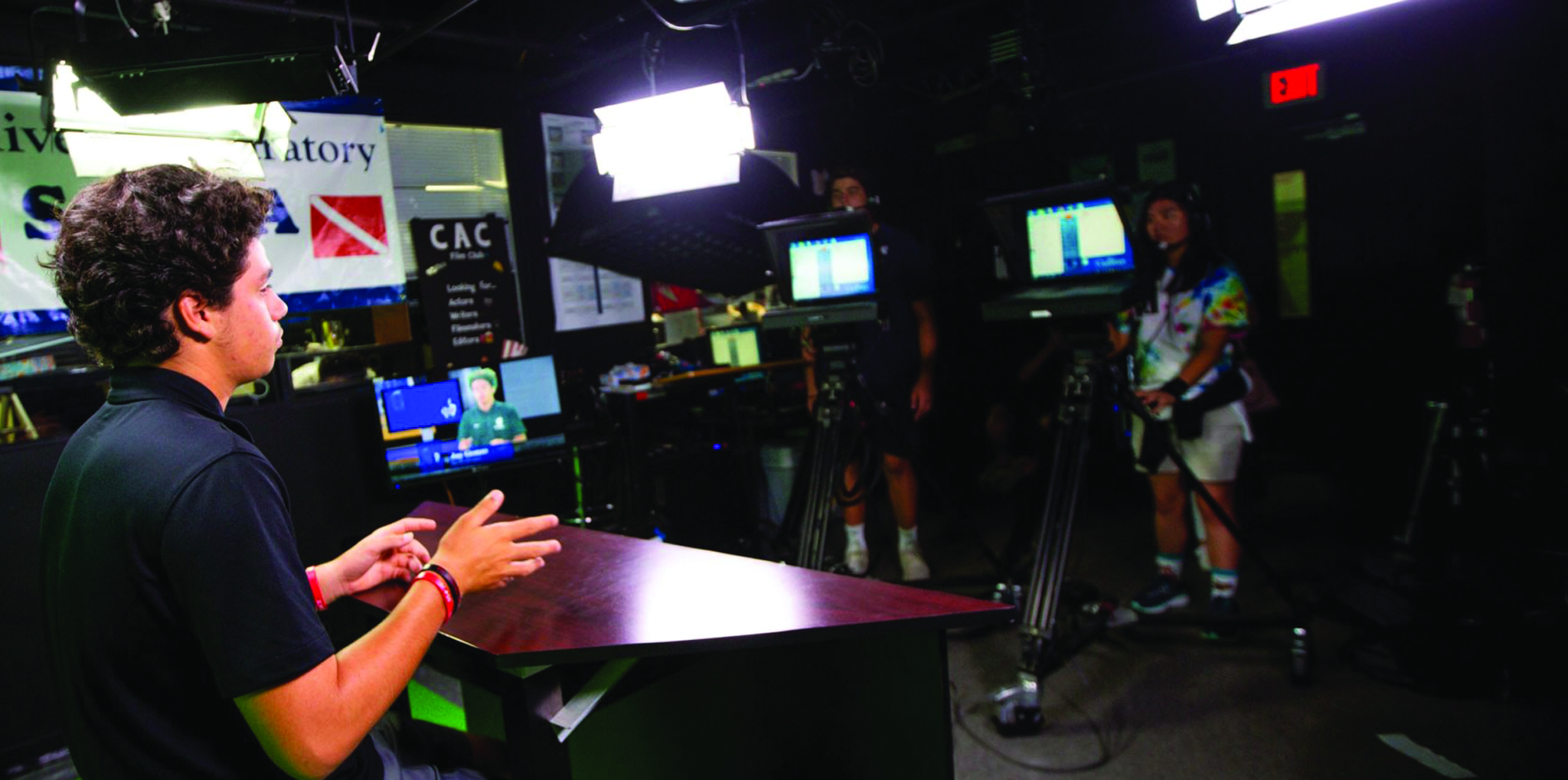 Student in newsroom recording session